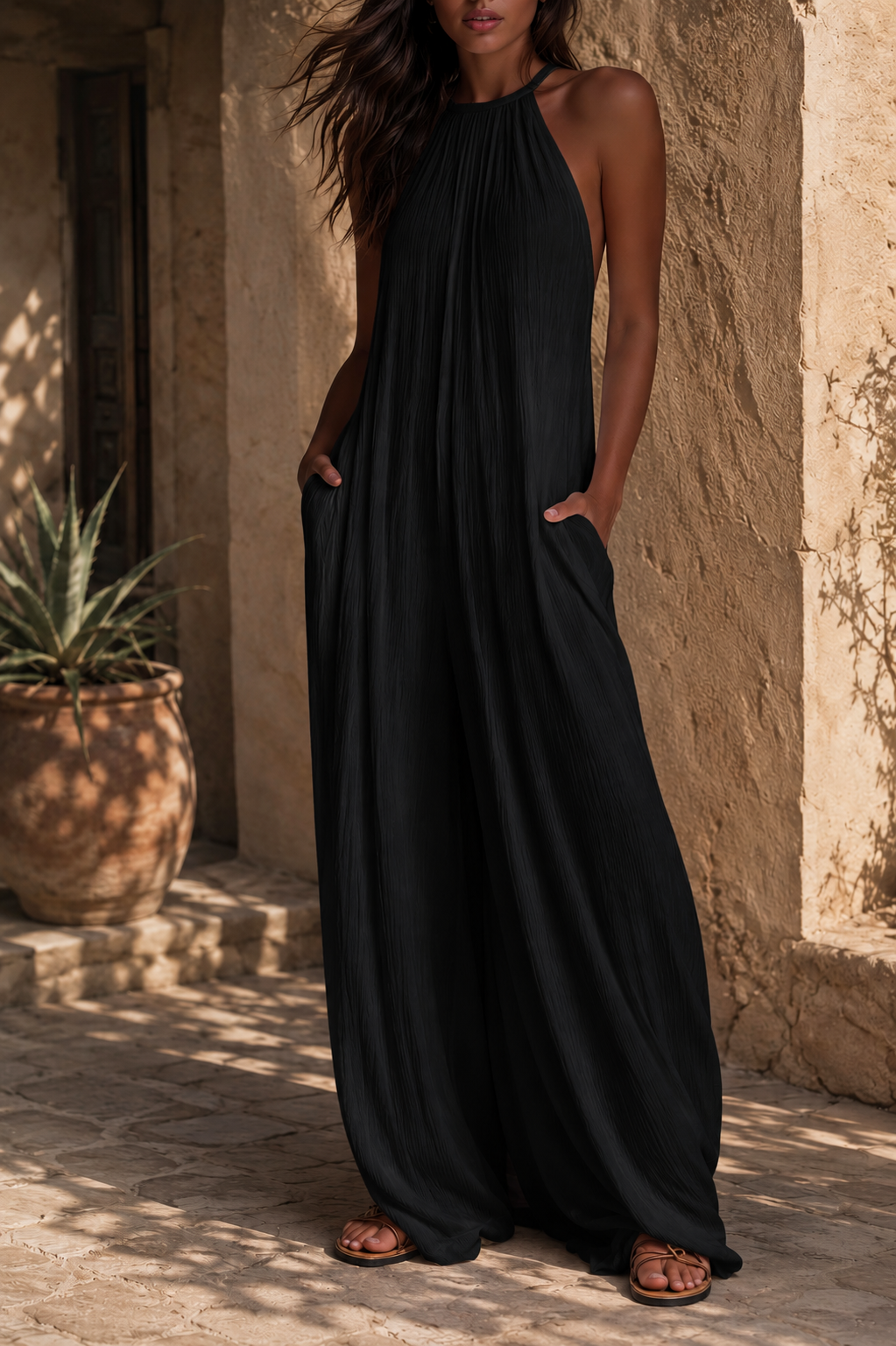 Tuta elegante smanicata con pantaloni palazzo